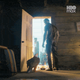 a man standing in front of a door with hbo max written on the bottom