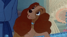 a lady and the tramp cartoon dog is looking at the camera