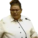 a man wearing glasses and a white shirt is speaking into a microphone .