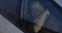 a man in a car with a sticker on the side that says a