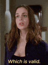 a woman in a blue jacket with the words " which is valid " below her