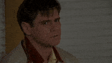 a man with a scarf around his neck and the words what the hell are you talking