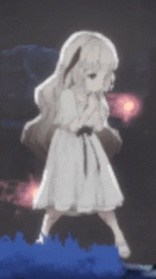 a little girl in a white dress is standing in a dark room .