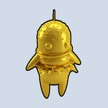a gold statue of a hamburger with a toothpick in it