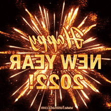 a fireworks display with the words happy new year written in gold letters