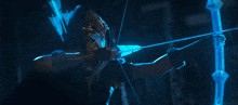 a person holding a bow and arrow with a blue light behind them