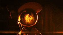 a person is standing in the dark with a light coming out of their hand .