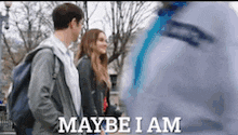 a man and a woman are standing next to each other with the words maybe i am on the bottom