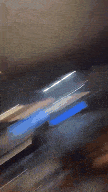 a blurry picture of a person standing in front of a wall