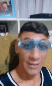 a man wearing a pair of blue swim goggles