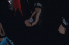 a group of people are holding watches and a small clock that says ' clock ' on it in their hands