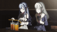 two anime girls are sitting at a table with drinks