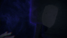 a close up of a person 's face with a purple glow