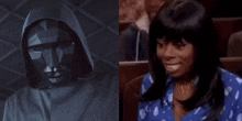 a man in a hooded mask next to a woman