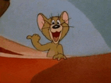 jerry from tom and jerry is waving from behind a wall .