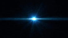 a bright blue light shines in a dark space
