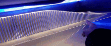 a close up of a comb with a blue light behind it