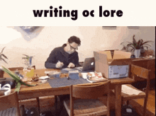 a man is writing on a piece of paper at a table .