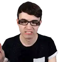 a young man wearing glasses and a black shirt makes a funny face