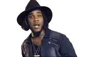 a man wearing a hat and a leather jacket .