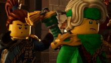 two lego figures are standing next to each other and one has a sword in his hand