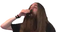 a man with long hair and a beard wearing a black shirt with the word slayer on it