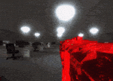 a dark room with a red object in the middle of it