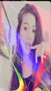 a woman 's face is surrounded by a rainbow of colored lines