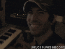 a man playing a keyboard with the words deuce 9 lives discord on the bottom right