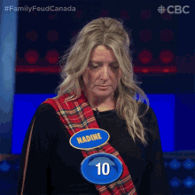a woman with a name tag that says nadine and a number 10