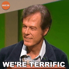 a man says " we 're terrific " in front of a green screen