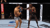 two men are fighting in a ring with ads for hudson and bodyarmor