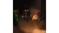 a cartoon drawing of a robot holding a flashlight and a red object that says c.l.m.z.