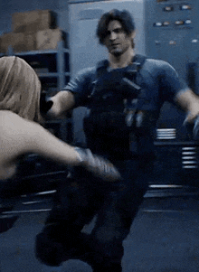 a man and a woman are fighting in a room .