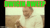 a man in a white jacket is holding something in his hand and the words dwigin dweep are displayed above him