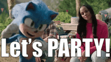 a woman sits next to a sonic the hedgehog mascot and says let 's party !