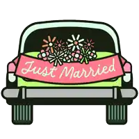 a green car with flowers on the back and a just married banner