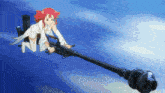 a girl with red hair is holding a very long weapon