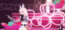 a girl in a white coat is dancing on a stage in front of a neon heart .