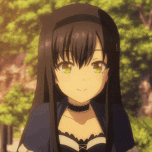 a girl with long black hair and green eyes smiles for the camera