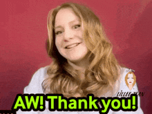 a woman is smiling and says aw thankyou