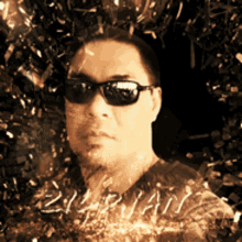 a man wearing sunglasses stands in front of a wall with the word brian written on it