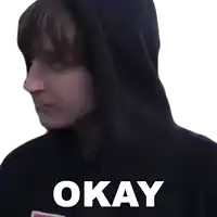 a woman wearing a black hoodie with the word okay on it