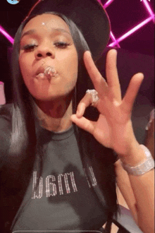 a woman wearing a black shirt that says lgbtq
