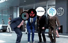 a group of men are dancing in front of a building that says function 4