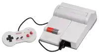 a white nintendo video game system with a controller attached