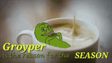 a cup of coffee with a frog on it and the words groyper is the reason for the season