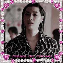 a picture of a man with the name niragi de conaki on the bottom right