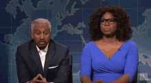 a man and a woman are sitting next to each other and the man is asking the woman if she has a question for her .