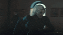 a blurry picture of a person standing in front of a window with the words thunderbolts on the bottom
